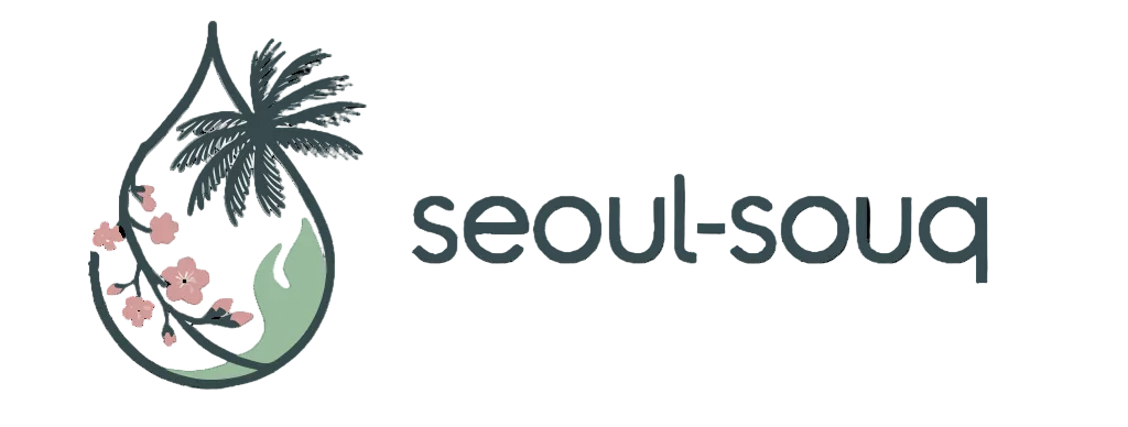 Logo of Seoul Souq with a palm tree and floral elements inside a droplet shape on a white background.